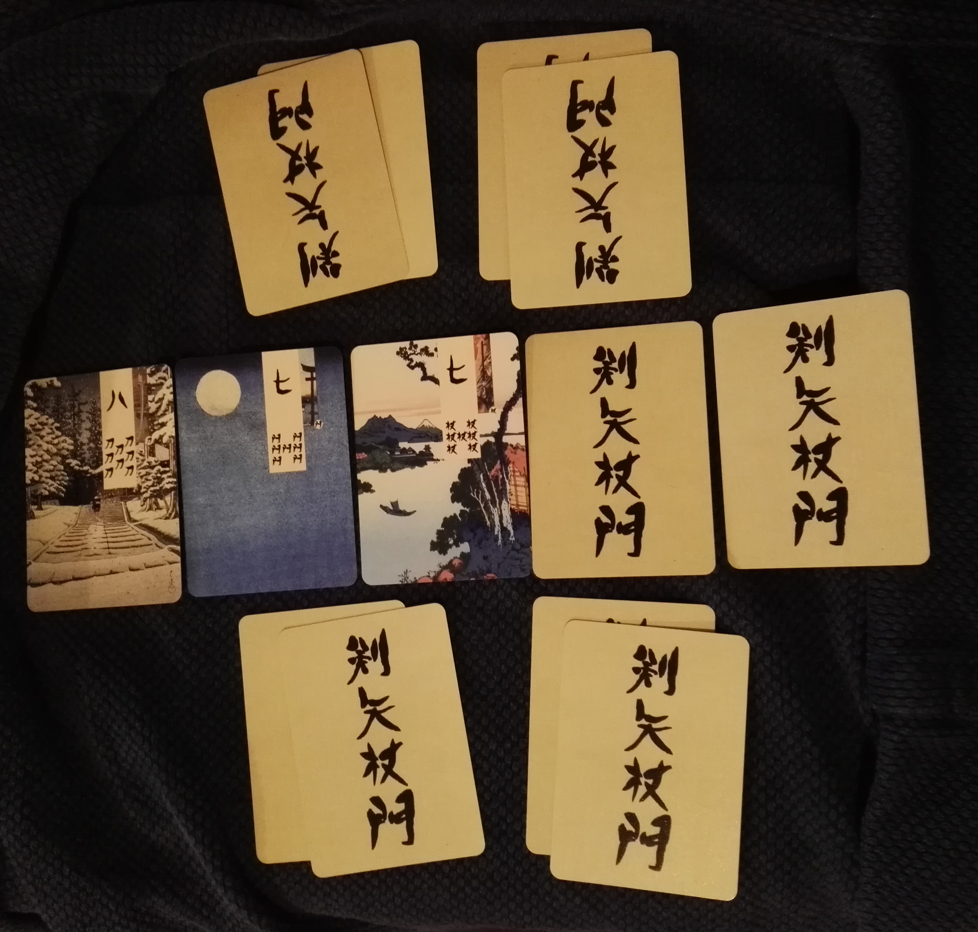 A Game of Midas Creek Poker with three cards in the grove, using a Classic, Ukiyo-e Style Age of Heroes Deck